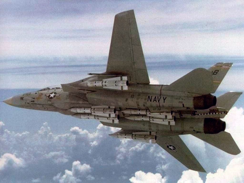 An F/A-111X on the ground with its weapons bays open and AIM-54 Phoenix and AIM-7 Sparrow missiles visible